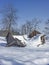 Dilapidated alpine hut in winter