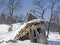 Dilapidated alpine hut in winter