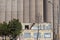 Dilapidated Building and Grain Storage Silos