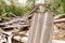 Dilapidated building with reinforced concrete columns and broken slate