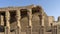 The dilapidated colonnade and wall in the ancient temple of Horus in Edfu