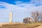 Dilapidated Farm House and Silo in the American Midwest