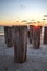 Dilapidated ruins of a pier on Port Royal Beach at sunset