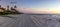 Dilapidated ruins of a pier on Port Royal Beach at sunset