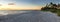 Dilapidated ruins of a pier on Port Royal Beach at sunset