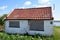 A dilapidated small farm along the river Rotte