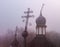 Dilapidated steeple on an Orthodox Ukrainian Church during a grey foggy morning