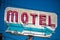 A dilapidated, vintage motel sign in the desert of Arizona