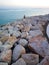 A diligent fisherman catches fish near the open sea on the island of Pag.