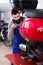 Diligent male worker working at restoring motorbike in workshop