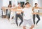 Diligent young man doing choreography at ballet barre