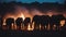 In the dim light of a bonfire, a gathering of elephants mingles.