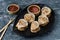 Dim sum dumplings in steamer and ingredients. Chinese dumplings close up on sticks