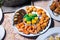 Dim sum in plate. Assorted dim sum appetizers on table background. Set of Chinese food for share