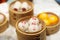 Dim sum, traditional Chinese dumpling in bamboo steamer, pig and animal theme for kids. Street food for children in China, Hong