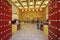 Diminishing perspective view of the building interior of a buddies temple. Golden Buddha in the temple