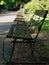 Diminishing perspective view of wooden benches at dusk