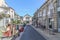 Dinard, Ille-et-Vilaine, France - July 31 2018: Pretty small traffic free street with shops putting out their stock on the street