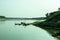 Dinghy boats or fishing boats tied to the river shore