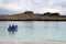 Dinghy motoring from the beach of Chinese Hat island, Galapagos