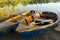 Dinghy Paddle Boat on Clear Water. Oar