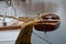Dinghy, small rowing boat made of mahogany wood, attached to the stern of a sailing yacht