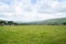 Dingle in distance, across expansive fields leading to coast