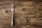 Dining fork on vintage wooden table