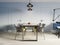 Dining metal table with decor and four designer wicker chairs. Scandinavian interior design, nordic style