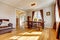 Dining room with brown curtain and hardwood floor.