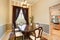 Dining room interior with nice table set and brown curtains