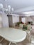 Dining room interior white colors. Wide angle spacious contemporary interior room designs