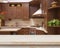 Dining table on blurred brown kitchen interior background