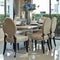 Dining table and comfortable chairs with elegant table setting