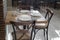 Dining table served with plates, glasses, forks and knives