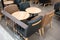 Dining wooden table with black and brown leather chairs for dining