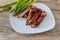 dinner of hot grilled beef meat ribs served with asparagus on plate