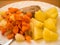 Dinner meal, braised carrot, boiled potatoes and meat