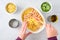 Dinner meal preparation, womanâ€™s hand mixing together ingredients for tuna noodle casserole