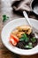 Dinner table Fried prunes oat cutlets black quinoa plate on wood