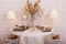 Dinner table served for two person decorated with winter decor.