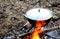 Dinner to cook on a fire in a bowler hat