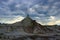 Dinosaur Provincial Park, Solitary Hoodoo with Prairie Thunderstorm brewing Overhead, Alberta, Canada