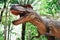 Dinosaur statue in the forest park - Tyrannosaurus rex