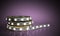 Diode strip Led lights tape in holder close-up 3d render on blue