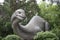 Diplodocus concrete sculpture in the Novosibirsk zoo. The dinosaurs were used top draw tourists. Dinosaur sculpture.