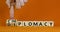 Diplomacy or chiplomacy symbol. Businessman turns cubes and changes the concept word diplomacy to chiplomacy. Beautiful orange