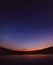 Dipper stars in the sky by the lake. Scenic landscape. Ursa majo