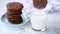 Dipping chocolate cookie in milk