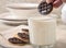 Dipping a cookie into a glass of milk